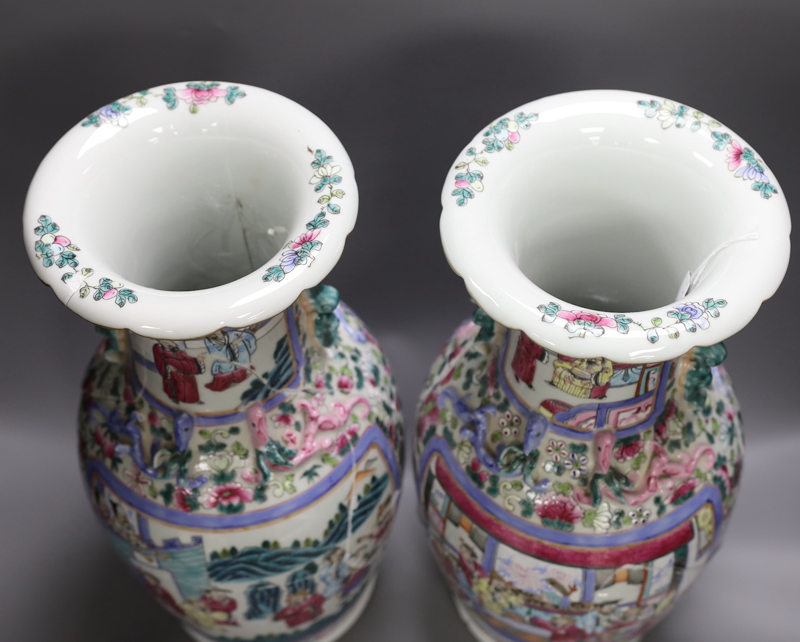 A pair of Chinese famille rose baluster vases and a bulbous brown glazed vase, all a.f, pair of vases 47 cms high